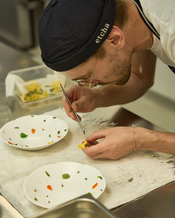 Chef plating in kitchen