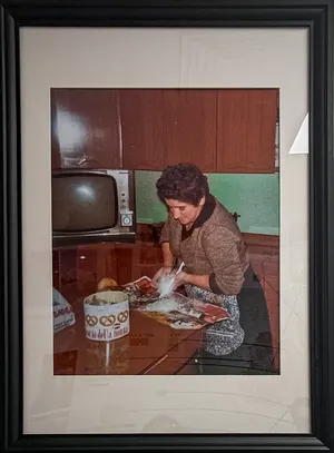 Framed photo of grandmother cooking